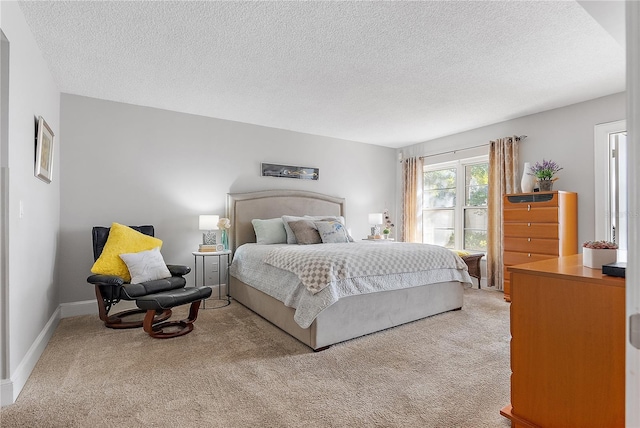 carpeted bedroom with a textured ceiling