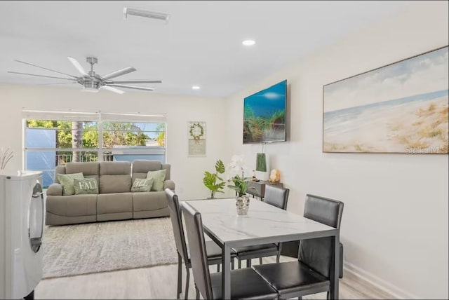 dining room featuring light hardwood / wood-style floors and ceiling fan