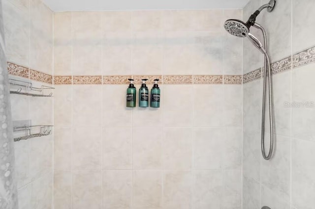 bathroom with tiled shower