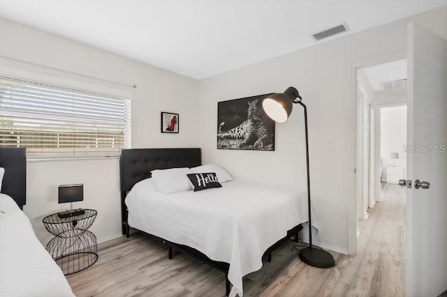 bedroom featuring light wood-type flooring