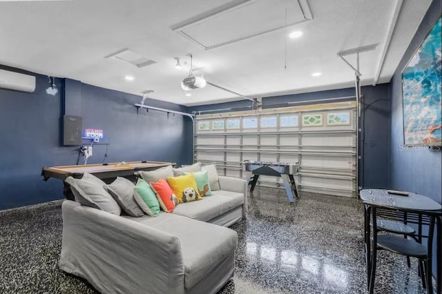 home theater room with an AC wall unit and electric panel