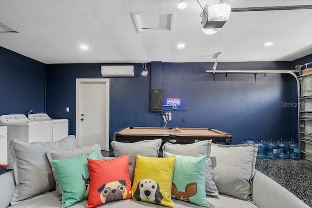 playroom featuring billiards, a wall mounted AC, electric panel, washing machine and dryer, and a textured ceiling