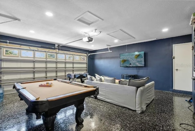 game room featuring a textured ceiling and pool table