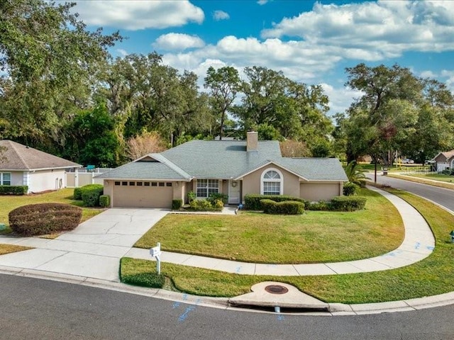 ranch-style house with a front lawn and a garage