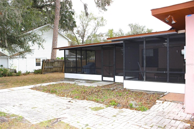 exterior space featuring a sunroom