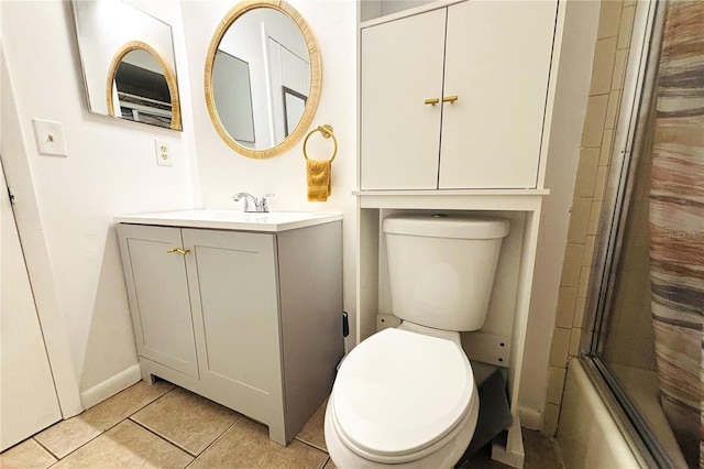 full bathroom with tile patterned flooring, vanity, toilet, and enclosed tub / shower combo