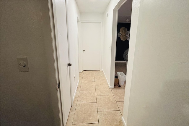 hall with light tile patterned flooring