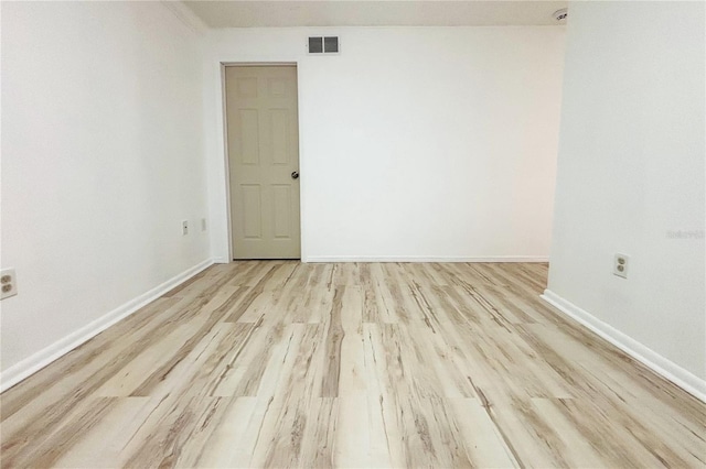 spare room with light hardwood / wood-style floors