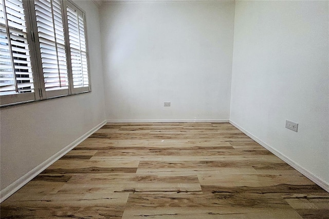 unfurnished room featuring light hardwood / wood-style floors