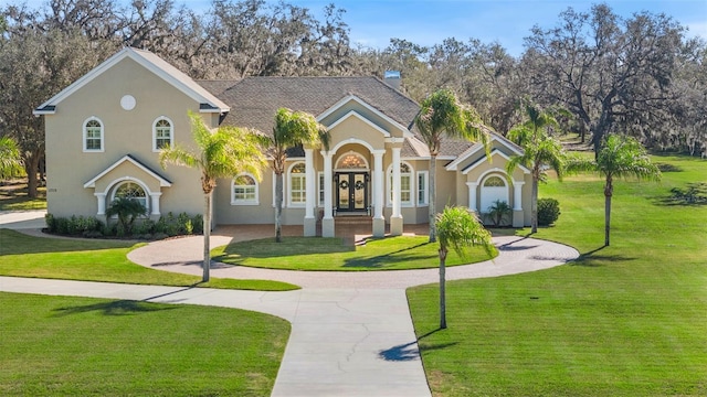 view of front facade with french doors and a front yard