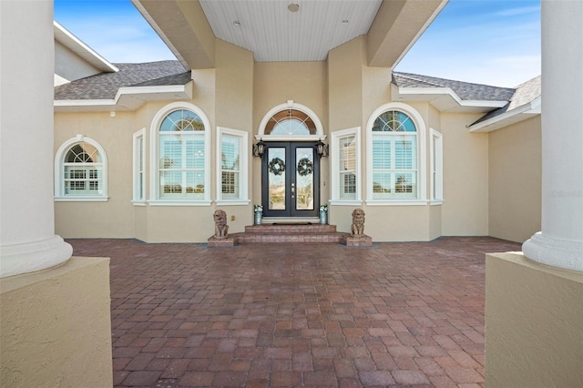 view of exterior entry featuring french doors