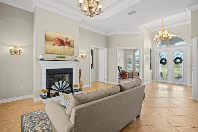 living room featuring ornamental molding, an inviting chandelier, french doors, and light tile patterned flooring