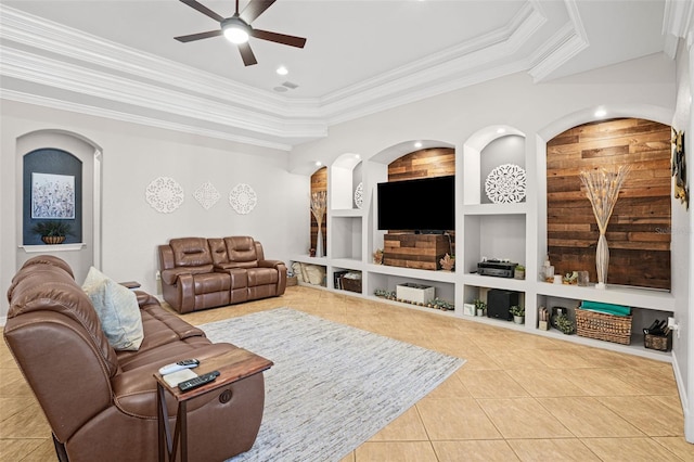 living room with ornamental molding, tile patterned floors, and built in shelves