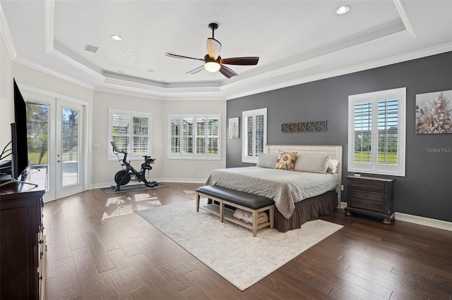 bedroom with access to outside, ceiling fan, and a tray ceiling