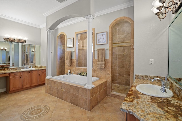 bathroom featuring ornamental molding, independent shower and bath, decorative columns, and vanity