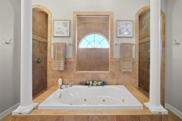 bathroom with tiled tub