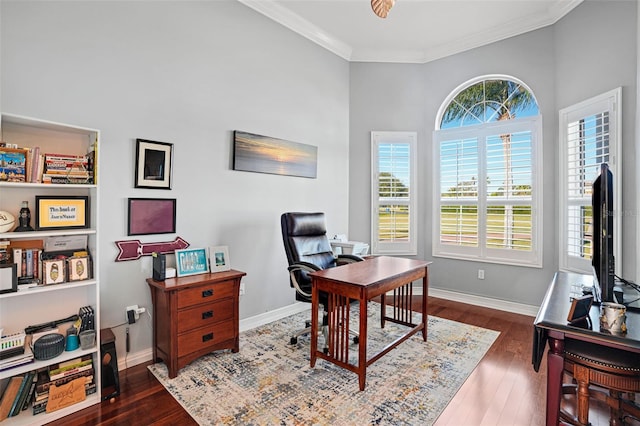 home office with ceiling fan, crown molding, and dark hardwood / wood-style floors