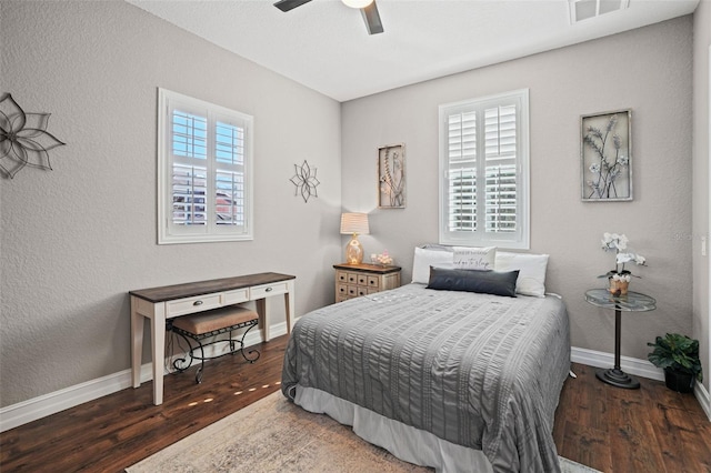 bedroom featuring ceiling fan and dark hardwood / wood-style floors