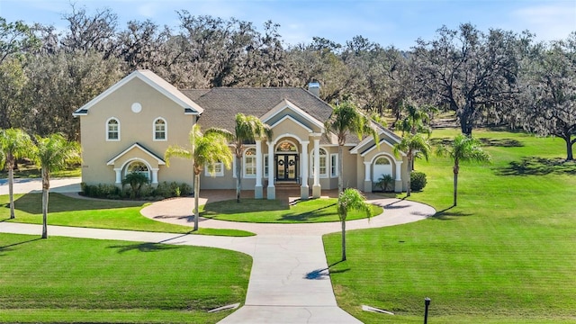 view of front facade featuring a front yard and french doors