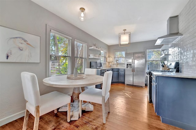 dining area featuring light wood-type flooring