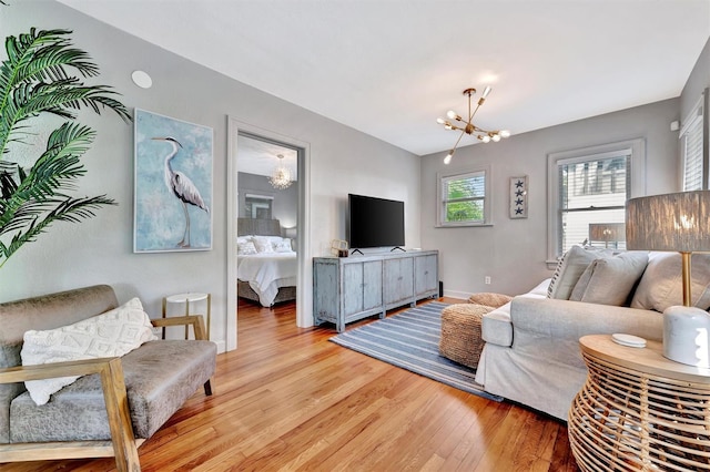 living room featuring hardwood / wood-style floors and a chandelier