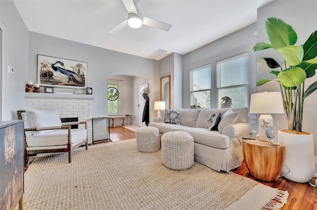 living room with hardwood / wood-style floors and ceiling fan