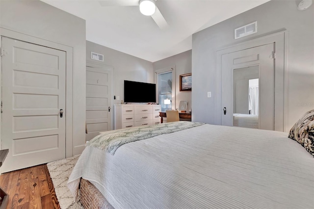 bedroom with hardwood / wood-style flooring and ceiling fan