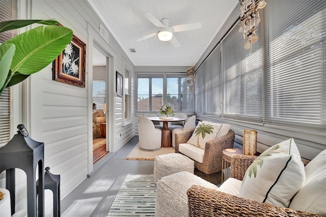 sunroom / solarium with ceiling fan