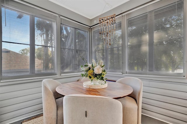 sunroom featuring a notable chandelier