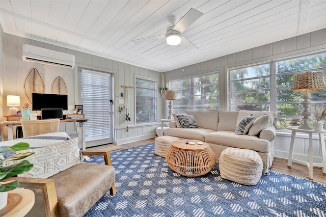 sunroom / solarium featuring an AC wall unit, ceiling fan, and wooden ceiling