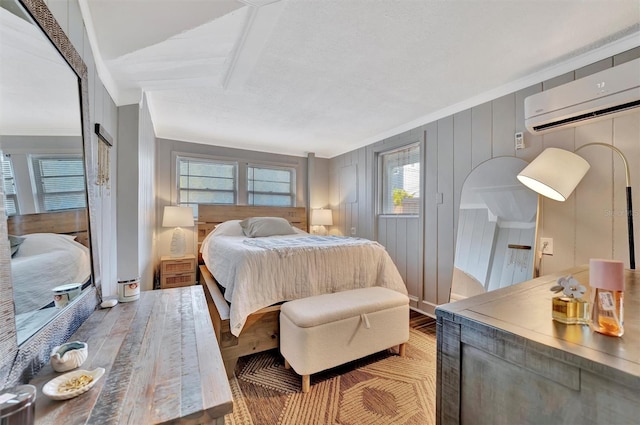 bedroom with light wood-type flooring, ornamental molding, and wood walls