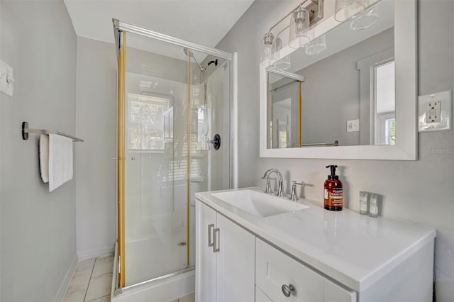 bathroom with tile patterned floors, vanity, and an enclosed shower