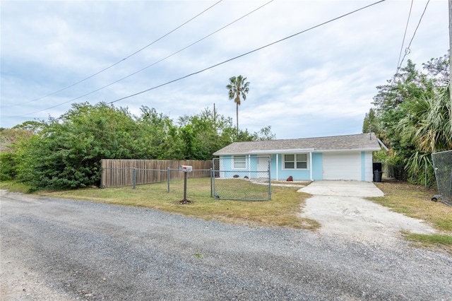 view of front of house featuring a front yard and a garage