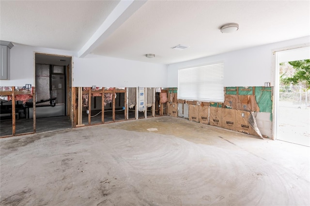 spare room featuring beam ceiling