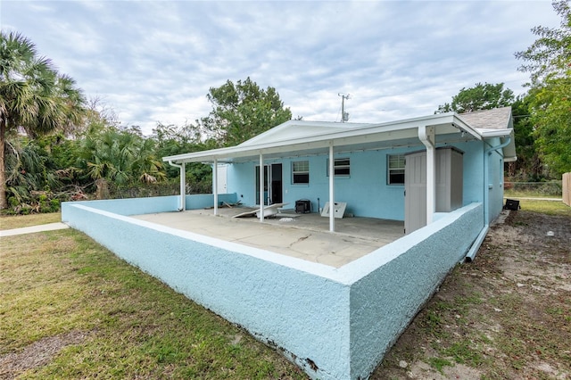 rear view of property with a patio