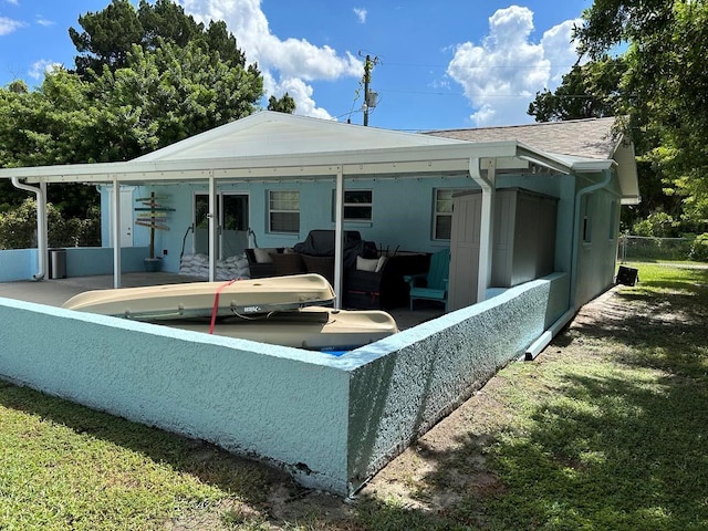 rear view of house featuring a patio