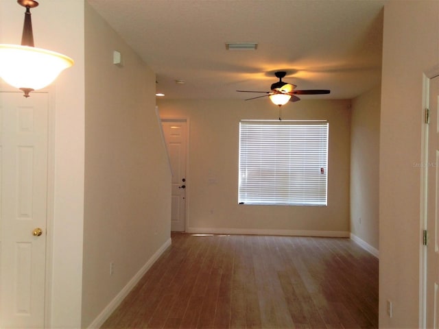 hall with dark hardwood / wood-style flooring