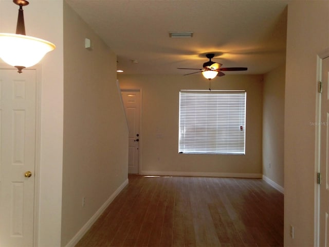 hallway featuring dark wood-type flooring