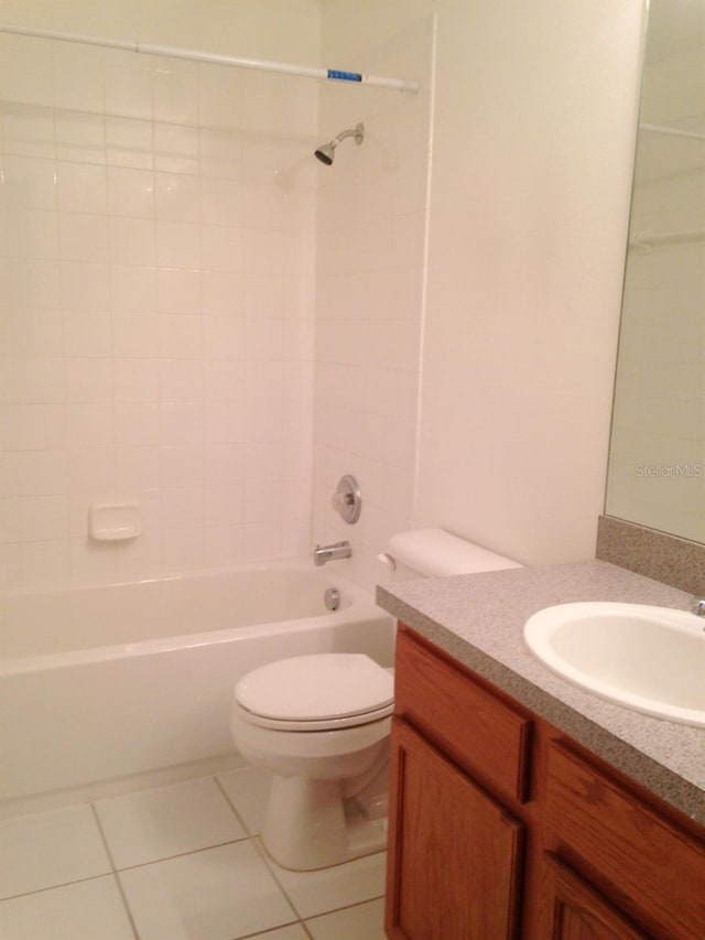 full bathroom with tile patterned floors, vanity, shower / bathtub combination, and toilet