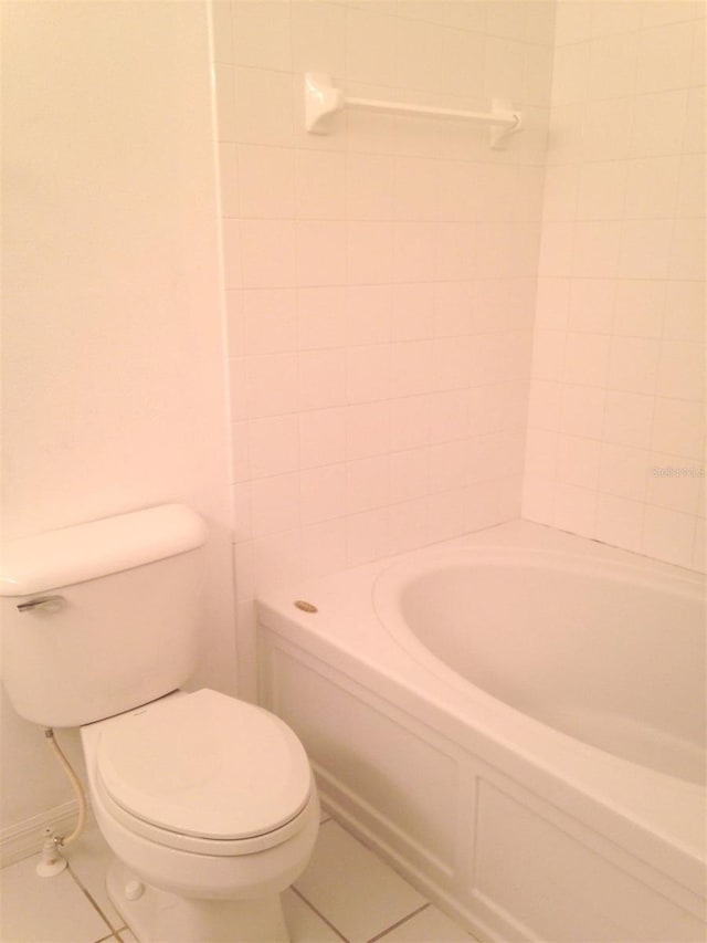 bathroom with tile patterned floors and toilet