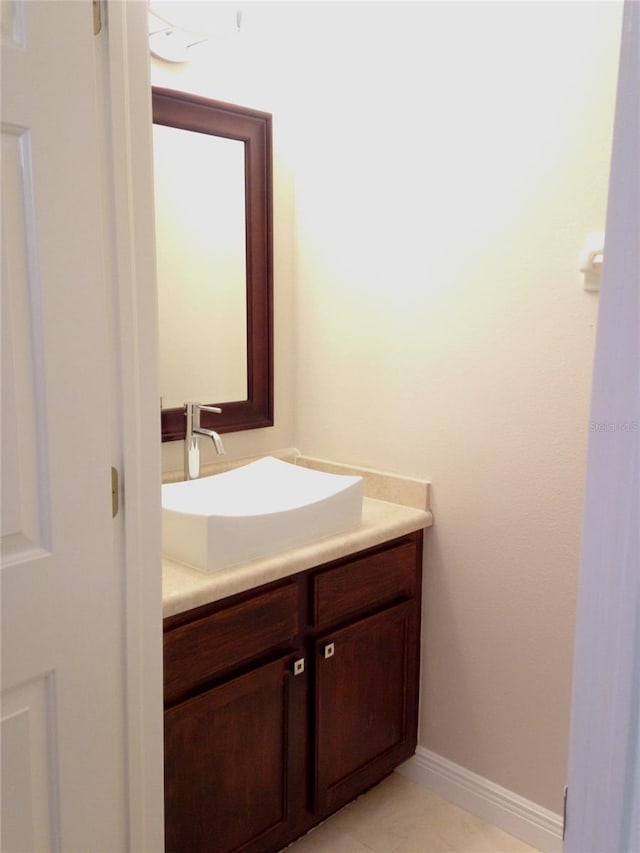 bathroom with tile patterned flooring and vanity