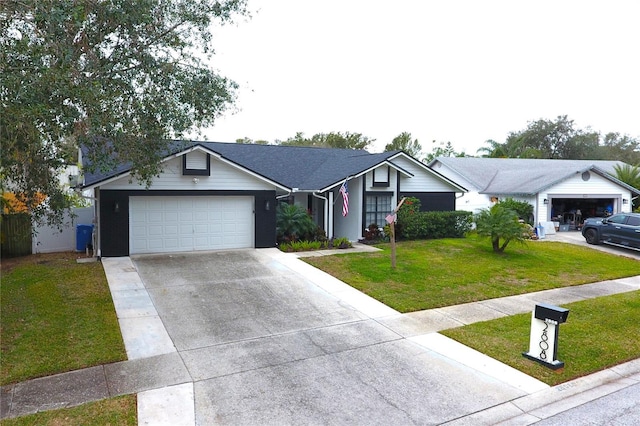 single story home with a front yard and a garage