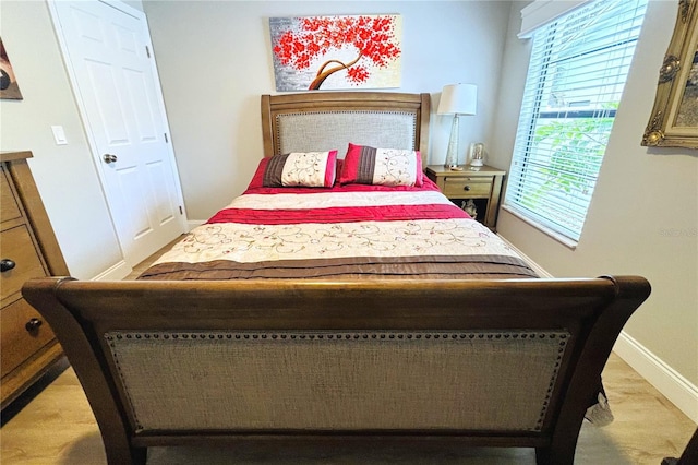 bedroom with light hardwood / wood-style flooring