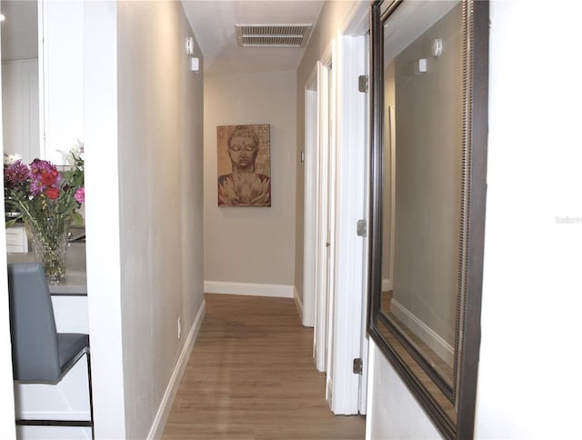 hallway featuring hardwood / wood-style flooring