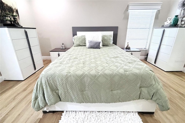 bedroom with light wood-type flooring