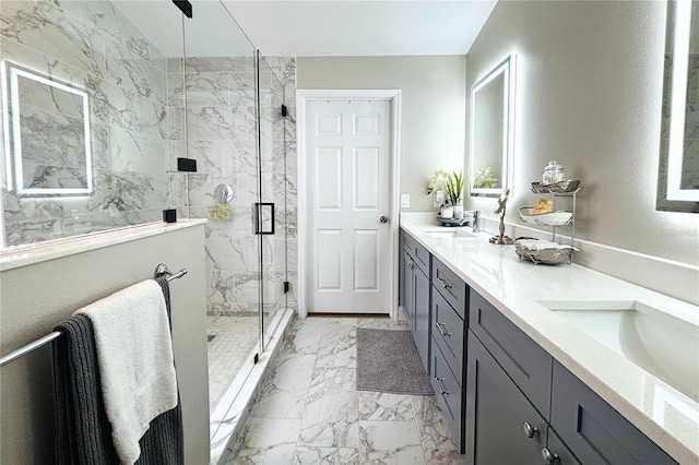 bathroom with a shower with shower door and vanity