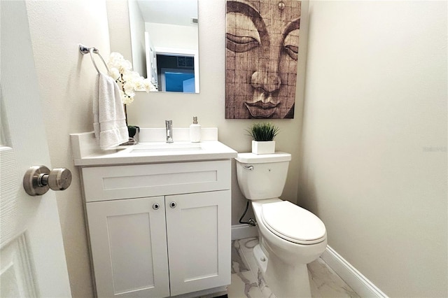 bathroom featuring toilet and vanity