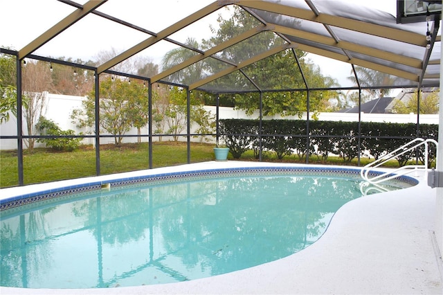 view of swimming pool with glass enclosure