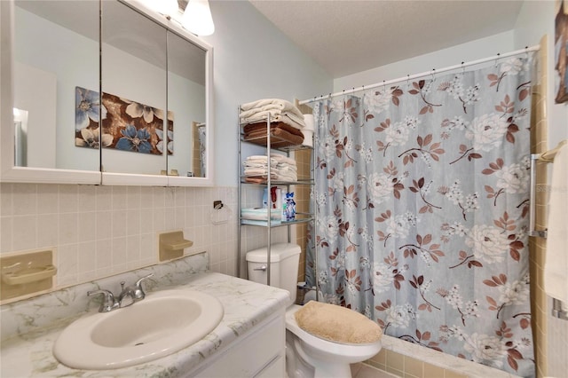 bathroom with toilet, a textured ceiling, tile walls, a shower with shower curtain, and vanity