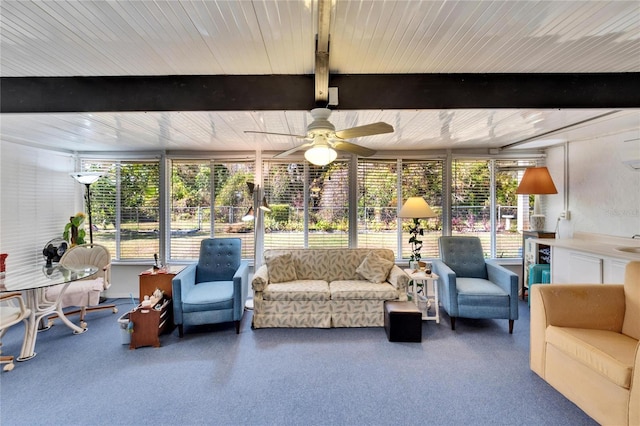 sunroom / solarium with beam ceiling, ceiling fan, and sink